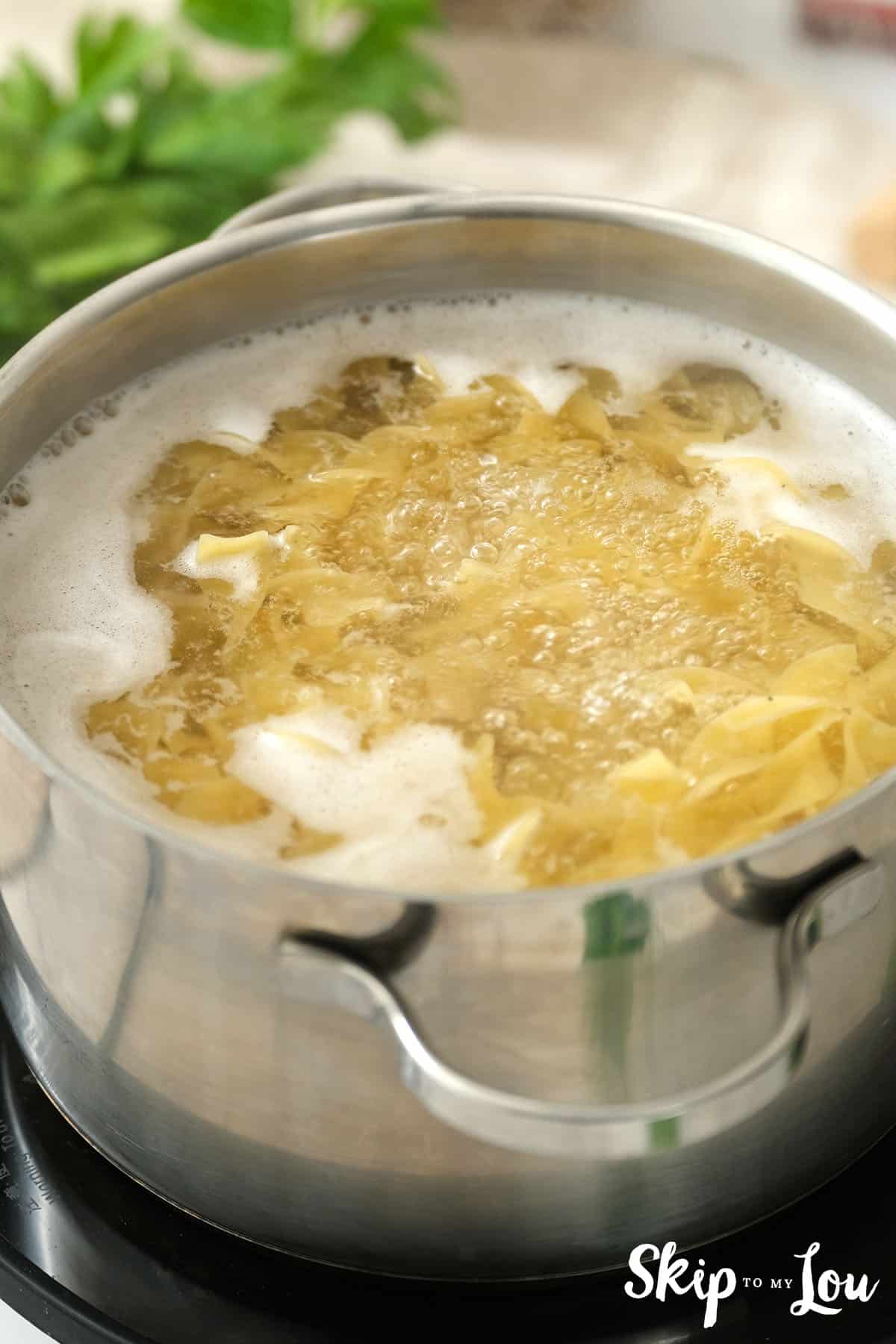 Pasta boiling in a large pot for the Tuna Noodle Casserole