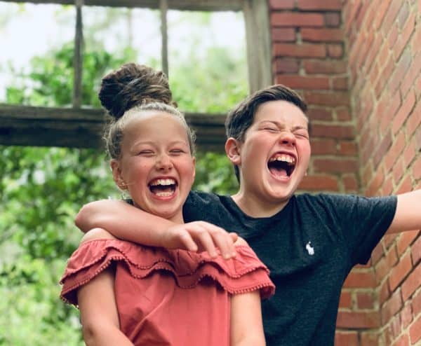 skip to my lou image of two kids laughing at kids jokes