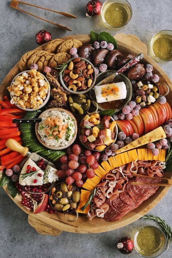 Image shows a charcuterie board with sweet and savory treats. via a farmgirls dabbles