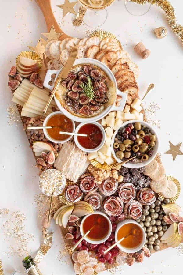 Image shows a large charcuterie sweet and salty board. From Amanda Wilens