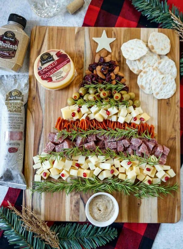 Image shows a charcuterie board shaped like a Christmas tree. from get on my plate