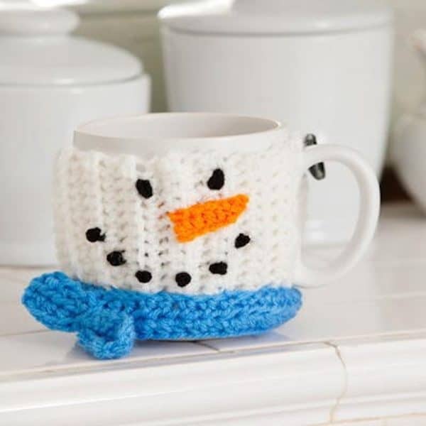 snowman mug holder on white mug on kitchen counter skip to my lou