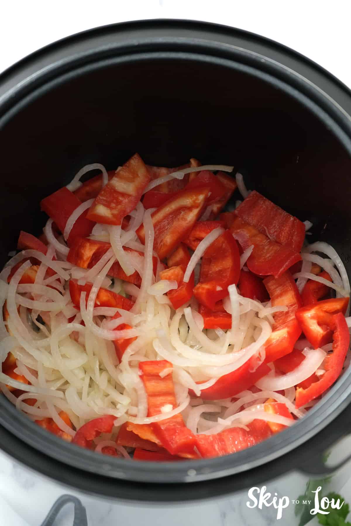 Vegetables in the instant pot ready to be sautéed for the Swiss Steak Recipe. -Skip To My Lou