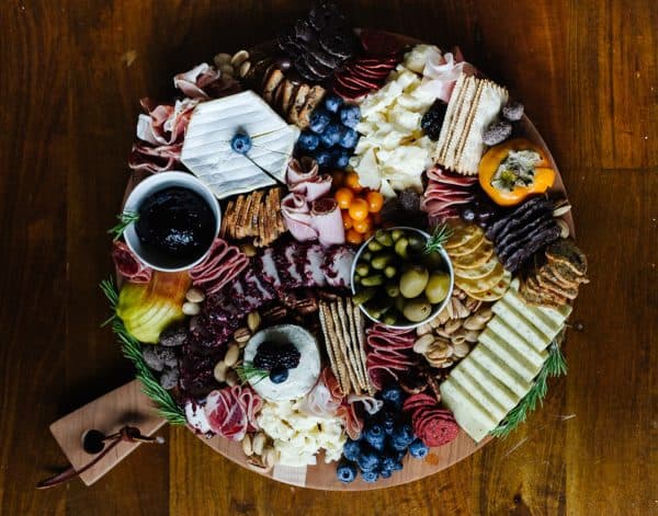 Image shows a beautiful charcuterie board with Thanksgiving theme.