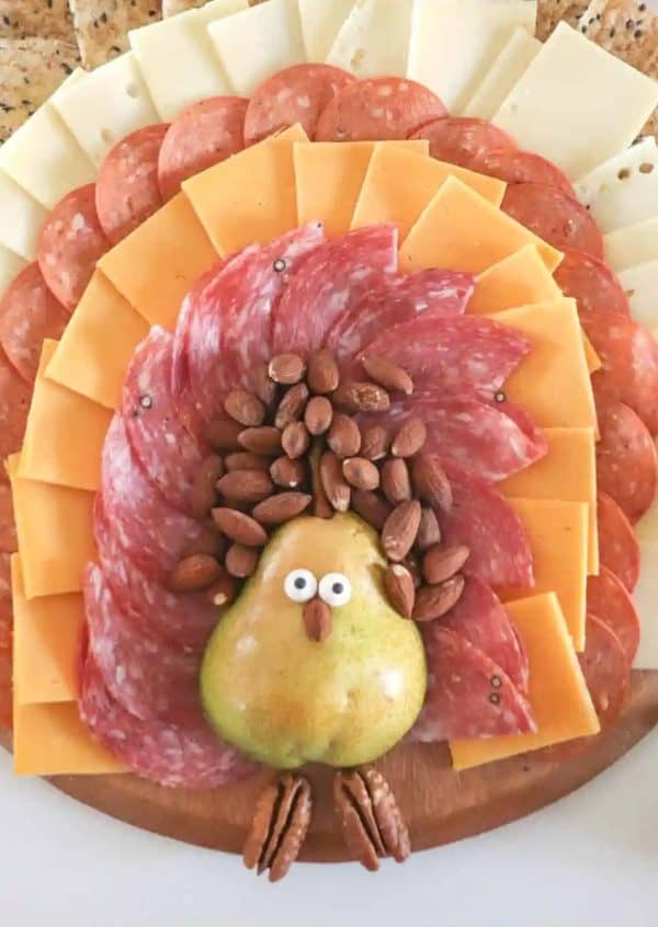 Image shows a turkey-inspired Thanksgiving charcuterie board.