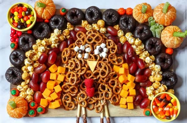 Image shows a turkey shaped charcuterie board