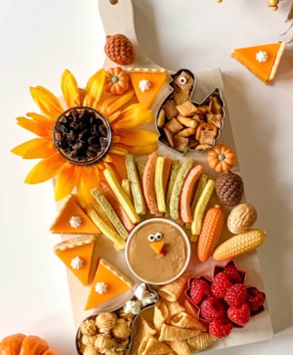 Image shows a Thanksgiving/Fall-themed charcuterie board.