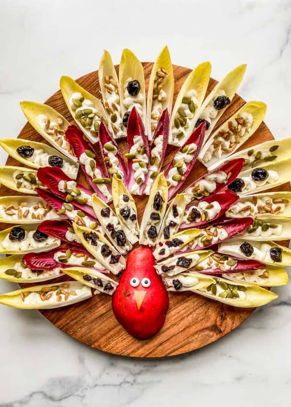 Image shows a fig charcuterie board with a thanksgiving theme.