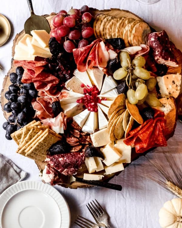 Image shows a charcuteie board with a Thanksgiving theme.