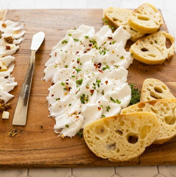 Image shows a simple cream cheese charcuterie board.