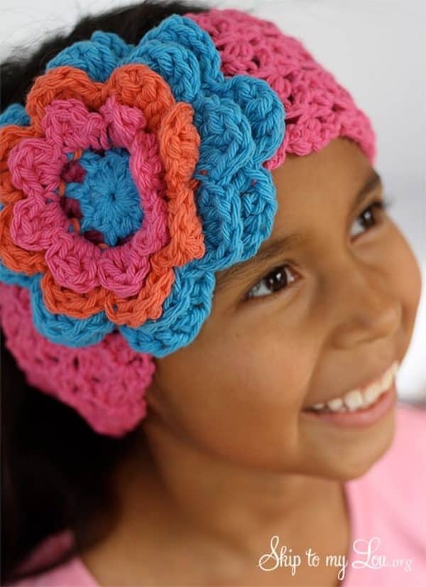 Crochet flower headband on a little girl skip to my lou