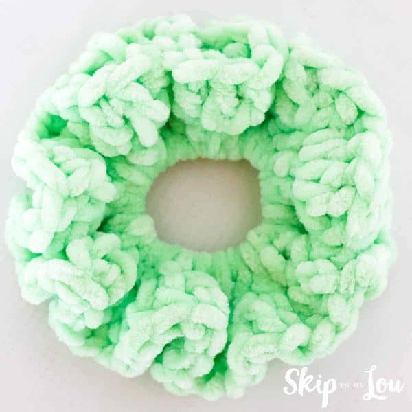 green hair scrunchie on white background