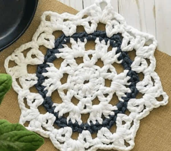 crochet trivet on brown table runner skip to my lou