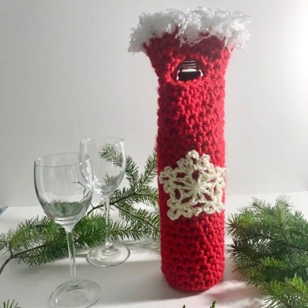 red and white crochet wine bag on holiday table skip to my lou