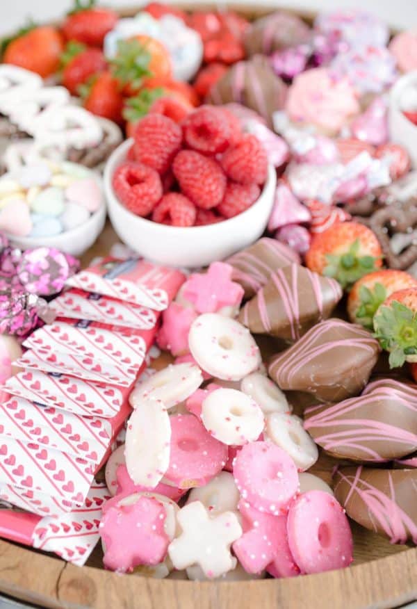 Image shows a dessert board with cookies, fruits, and chocolates. from devour dinner