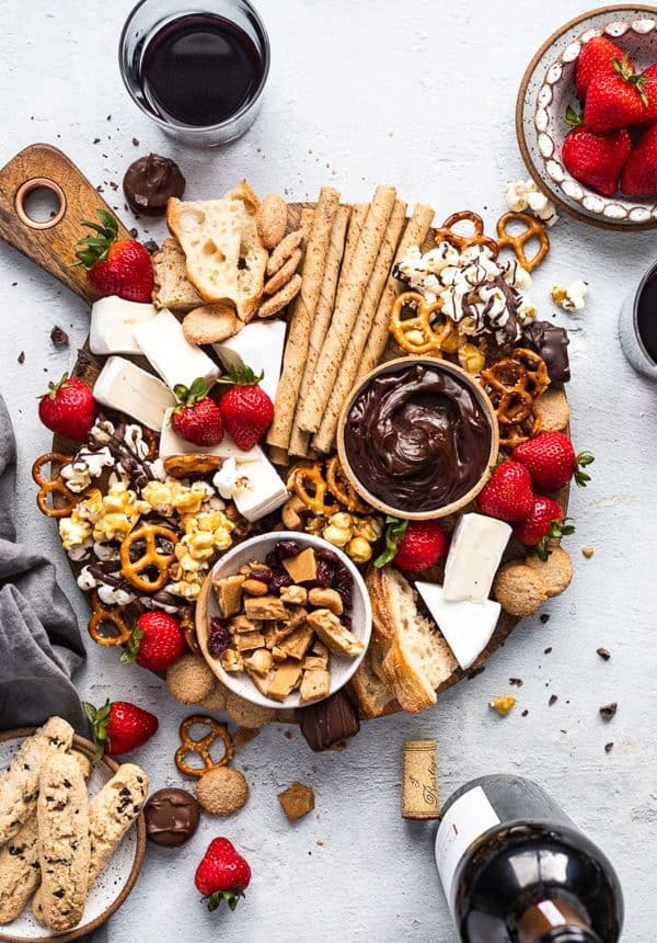 Image shows a sweet dessert board with pretzels fruits and chocolate, from Fork in the kitchen
