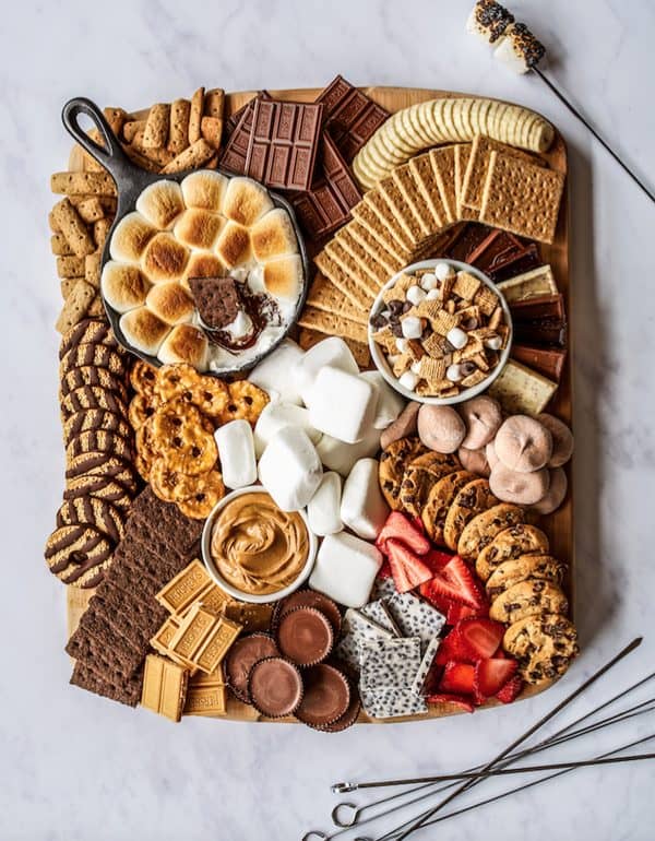 Image shows a smores, cookies, and other sweet treats dessert board. via nj familyFresh 