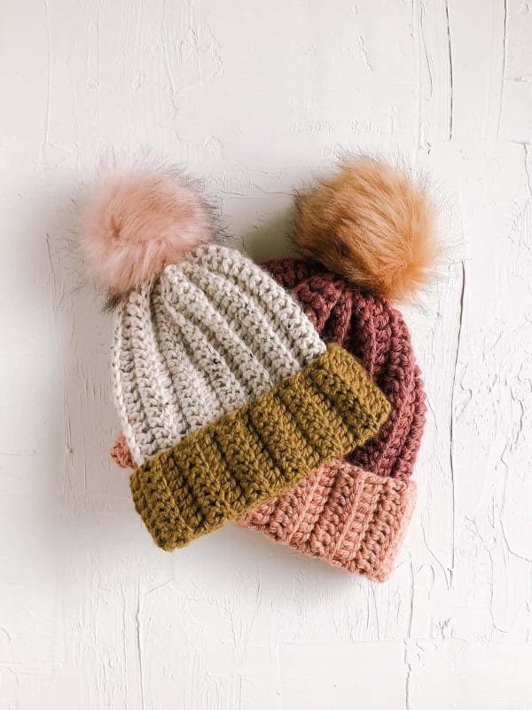 crochet beanie with fur ball on white background skip to my lou