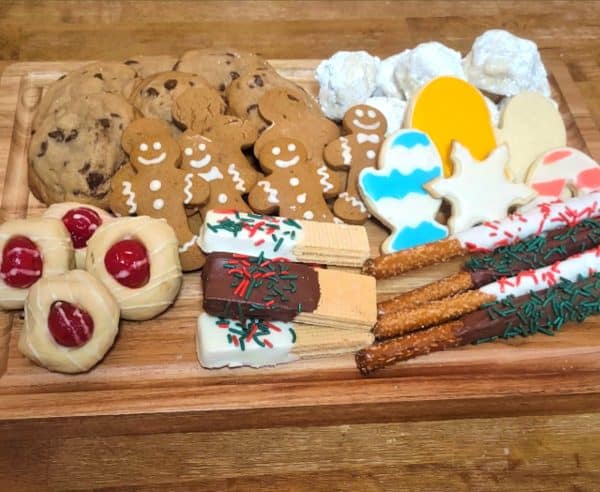 variety of yummy christmas cookies on a charcuterie board