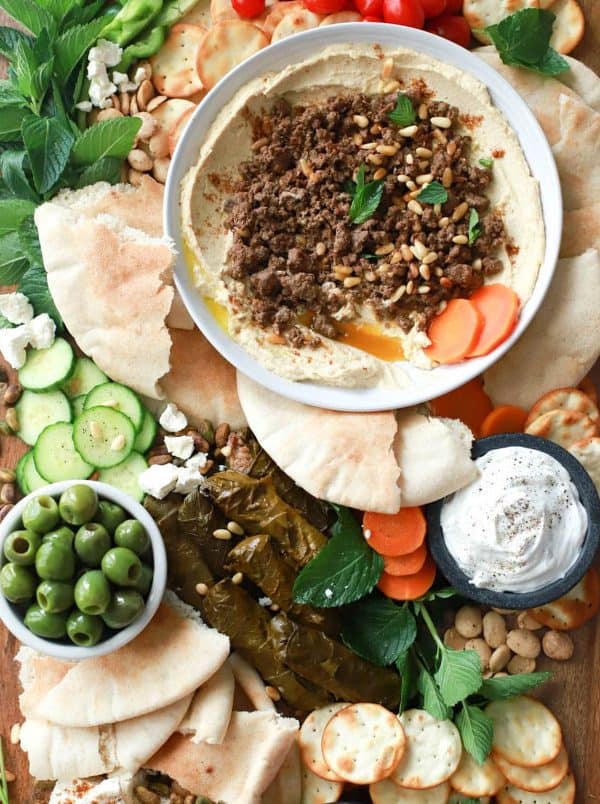 Image shows a Mediterranean hummus board.