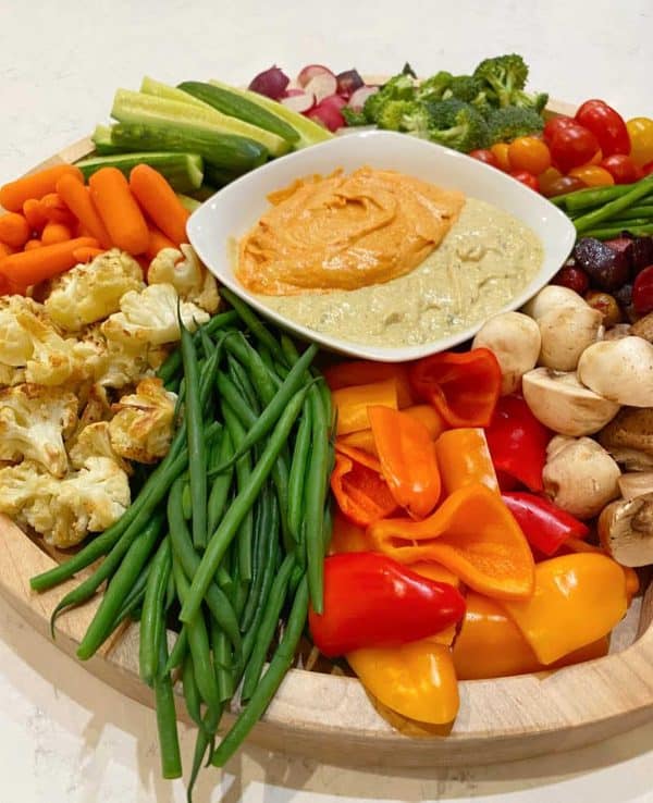 Image shows a vegetable and hummus board.