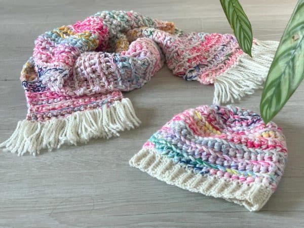 multi-color crochet scarf and hat set on wood floor skip to my lou