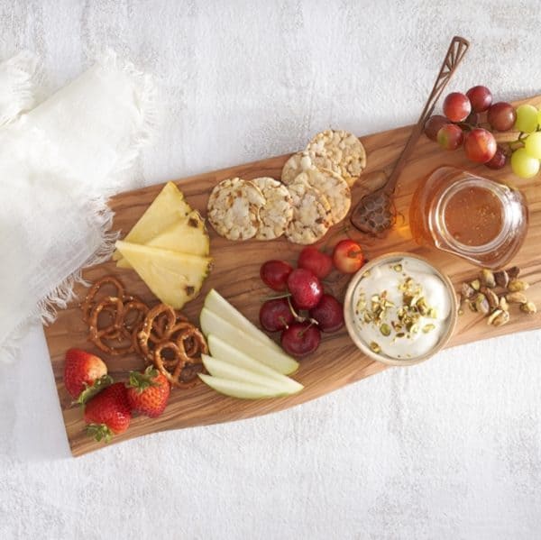 whipped cheese board recipes honey- a simple board with a few fruits, honey spiked cream cheese and a jar of honey.