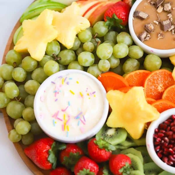 whipped cheese board recipes-the carefree kitchen-a simple kid friendly board with pineapple stars, grapes, and a cream cheese dip with sprinkles.