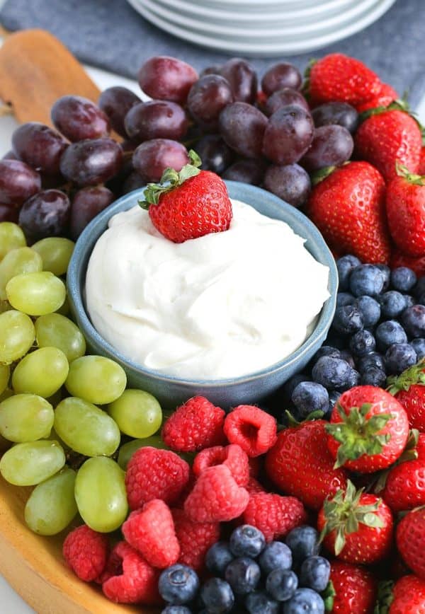 whipped cheese board recipes-the foodie affair- a fruit board with a homemade fruit dip in the middle.