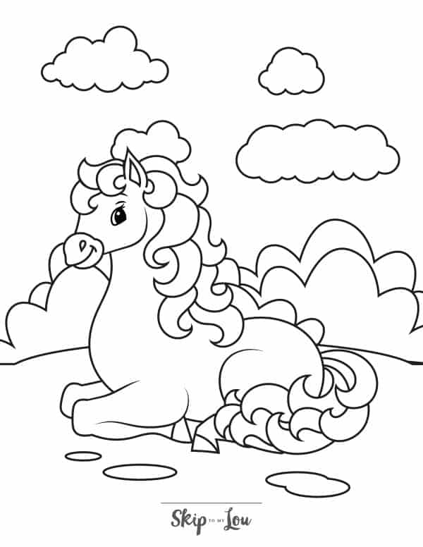 Black and white coloring page with a horse sitting down on a hill with bushes in the background by Skip to my Lou.
