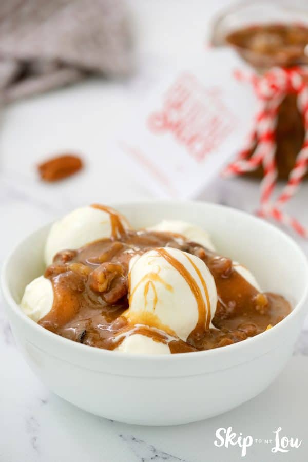 Image shows a vanilla ice cream with praline sauce on top of it- Skip to my lou