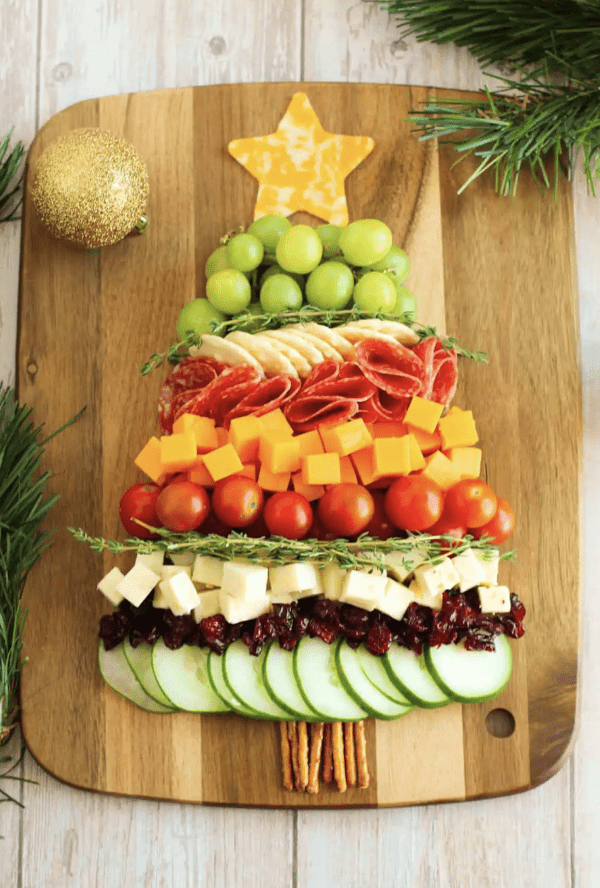 Christmas tree charcuterie board ideas- a simple board with cucumbers, grapes, tomatoes, and more. 