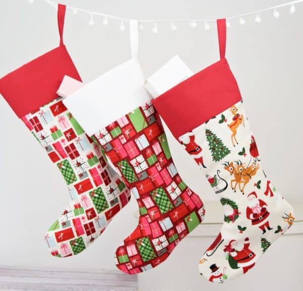 Imge shows three christmas stockings in different colors.