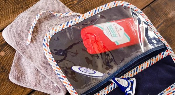 Travel shaving kit with towels and washing products.