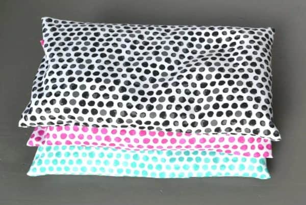 Homemade heating pads on top of each other with polka dot designs.