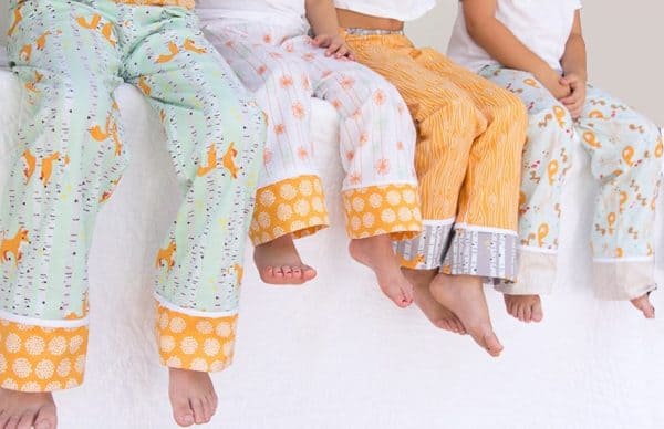 Image shows a family wearing matching pajamas.