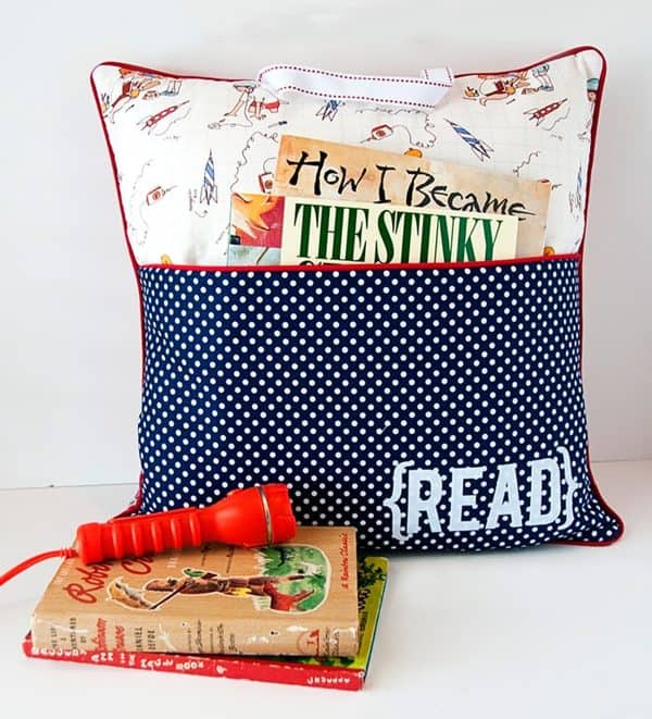 Pocket reading pillow with books in the pocket and next to it. text says "read"