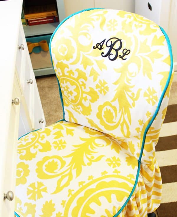 Office chair slipcover with yellow patterns.
