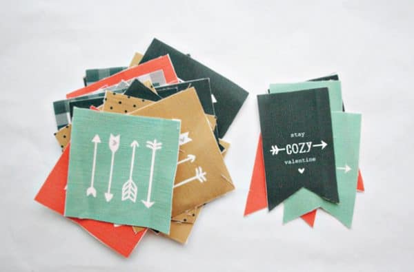 Hand warmers stacked on top of each other with designs and nice text.