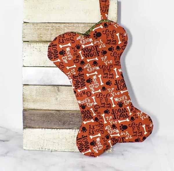 Image shows a dog bone christmas ornament.