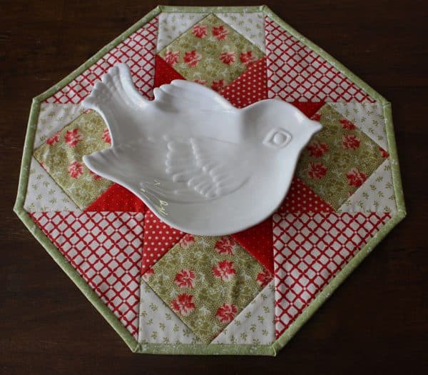 Image shows a cookie plate crumb catcher with a cookie plate on top of it.