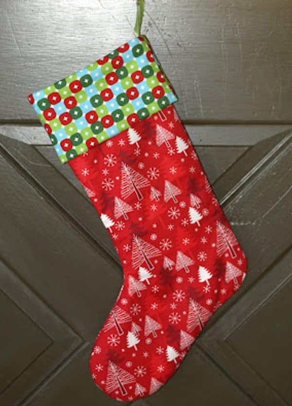 Image shows a stocking craft hanging from a wall.