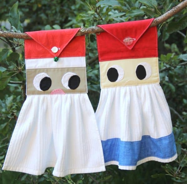 image shows two hanging kitchen towels that look like Santa and gnome.