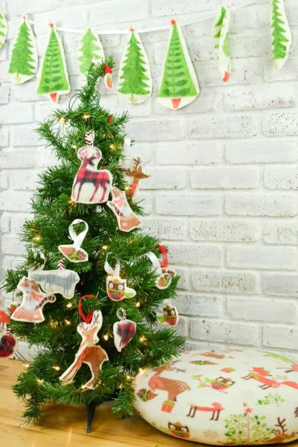 Image shows a kid-friendly christmas ornament on a tree.