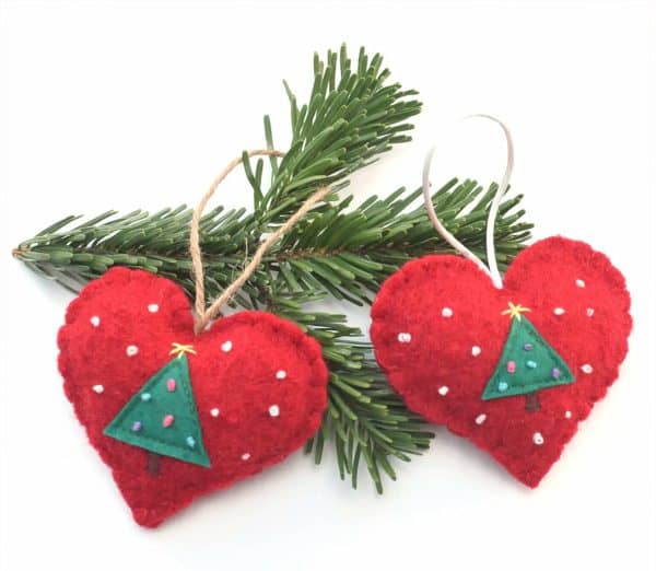 Image shows a two heart-shaped christmas ornaments.