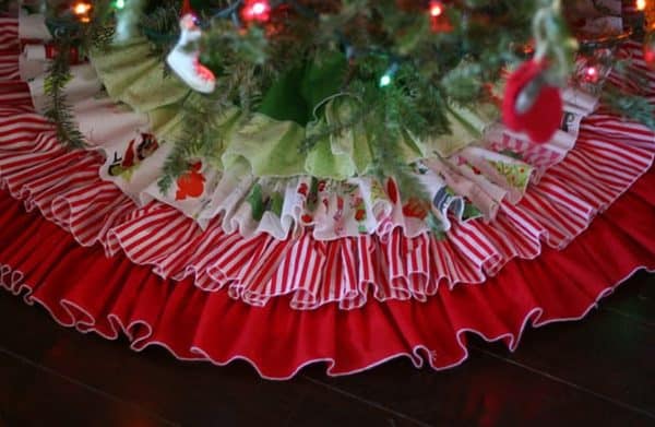 Image shows a ruffled tree skirt under a tree.