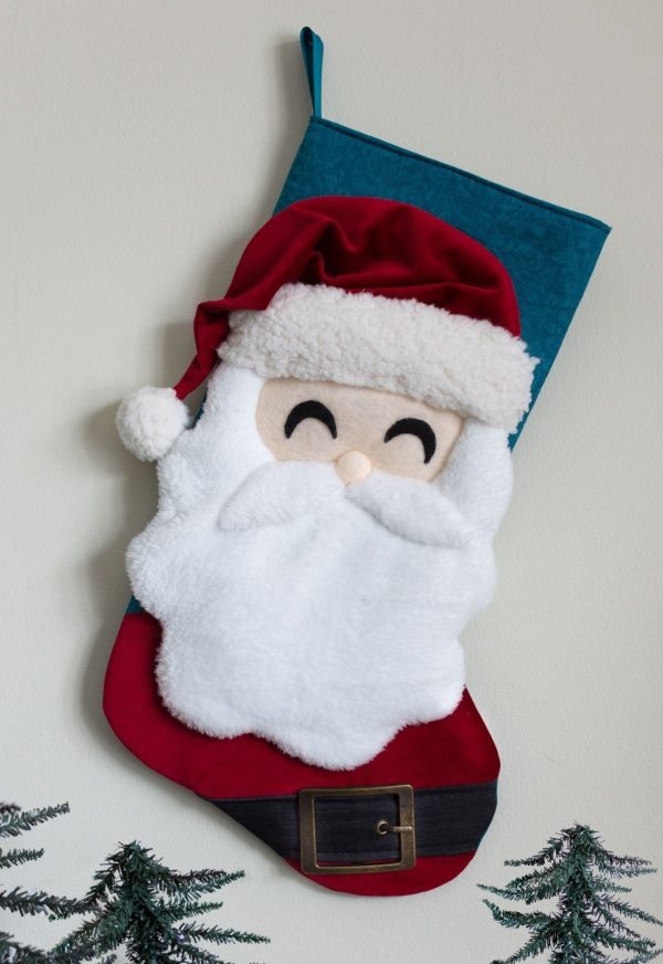 Image shows a santa stocking made with fleece and felt.