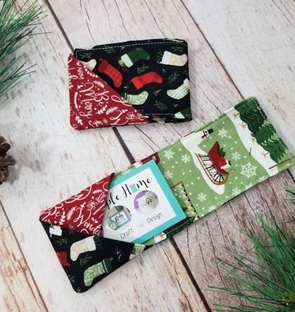 Image shows two fabric gift card holders with a festive theme.