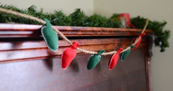 Image shows a christmas light garland hanging from a wall.