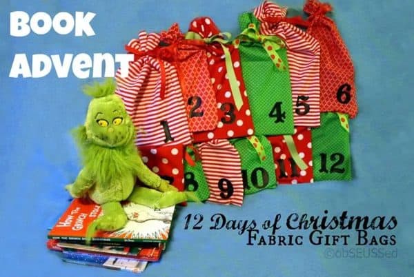 Image shows a 12 days of chritmas book advent calendar with a Grinch plushie on top of it.